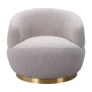 Small and circular boucle taupe swivel chair with rounded edges and brass base