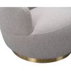 Small and circular boucle taupe swivel chair with rounded edges and brass base