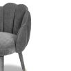 Grey clamshell chair with stitched sections