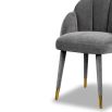 Grey clamshell chair with stitched sections