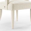 Upholstered boucle sand dining chair with open curved back