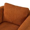 Rust orange chair upholstered with tube detailing