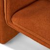 Rust orange chair upholstered with tube detailing