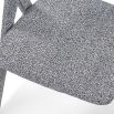 Speckle grey upholstered chair with c-shaped design