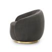 Upholstered dark grey velvet swivel chair with channelled detailing