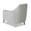 Light grey chair with striking silhouette