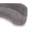 A sumptuous sofa by Liang & Eimil with a curved design and luxury grey velvet upholstery