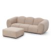 A luxury sofa by Liang & Eimil with a beautiful boucle upholstery and stunning shape