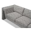 A stylish sofa by Liang & Eimil with an abstract shape and grey patterned upholstery