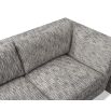 A stylish sofa by Liang & Eimil with an abstract shape and grey patterned upholstery