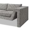 A stylish sofa by Liang & Eimil with an abstract shape and grey patterned upholstery