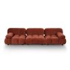 A statement sofa by Liang & Eimil with a modular design and soft red upholstery