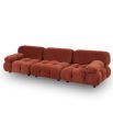 A statement sofa by Liang & Eimil with a modular design and soft red upholstery