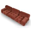 A statement sofa by Liang & Eimil with a modular design and soft red upholstery