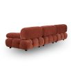 A statement sofa by Liang & Eimil with a modular design and soft red upholstery