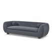 A contemporary sofa with two ball scatter cushions and a dark grey upholstery