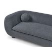 A contemporary sofa with two ball scatter cushions and a dark grey upholstery