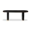 Bold black ash veneer dining table with brass accents