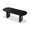 Bold black ash veneer dining table with brass accents