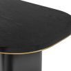 Bold black ash veneer dining table with brass accents