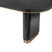 Bold black ash veneer dining table with brass accents