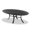 Oval shaped black ash dining table with curved legs