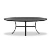 Oval shaped black ash dining table with curved legs