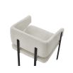 Squared wrap-around bar stool with neutral boucle upholstery and black frame