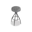 Grey upholstered round seated bar stool with boldly splayed open hourglass base with gentle tapering.