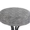 Grey upholstered round seated bar stool with boldly splayed open hourglass base with gentle tapering.