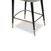 Art-deco inspired stool in dark grey velvet with fluting details and brass accents