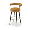 Chic upholstered bar stool with black legs and brass accents