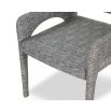 Elegant upholstered chair with arched supports and a complete fabric wrap in grey