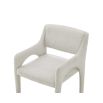 Elegant upholstered chair with arched supports and a complete fabric wrap in neutral boucle sand