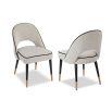 Boucle sand upholstered dining chair with black piping in a set of 2