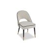 Boucle sand upholstered dining chair with black piping in a set of 2