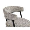 Minimal style dining chair in sherpa grey with rounded seat and curved backrest.