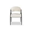 Elegant beige upholstered dining chair with arched black steel legs