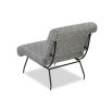 Speckled black and white upholstered armchair with rolled back