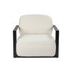 Cream upholstered armchair with angular black arms