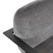 Dark grey upholstered armchair with angular black arms