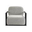 Grey boucle upholstered armchair with angular black arms