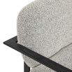 Grey boucle upholstered armchair with angular black arms