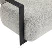 Grey boucle upholstered armchair with angular black arms