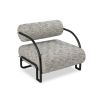 Speckled grey upholstered accent chair with rounded back and seat with black minimal arms