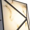 Geometric style wall lamp with faux alabaster shade.