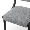 Black and white speckled upholstered chair with black frame