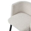 Boucle dining chair with wrap-around backrest and tapered legs