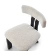 Elegant three-legged dining chair with boucle back rest and seat