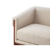 A sophisticated armchair with a contemporary design, luxury upholstery and classic brown finish